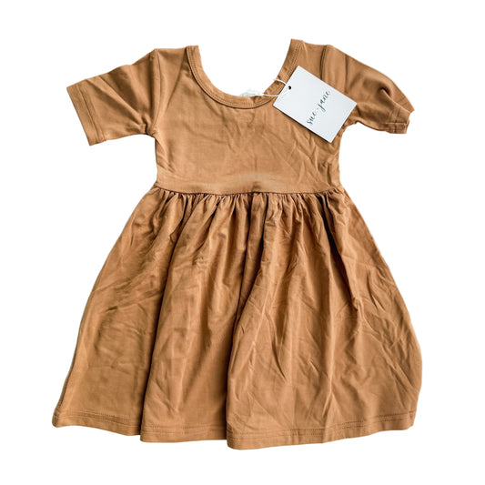 A brown twirl dress made of bamboo viscose and spandex, suitable for babies and toddlers, displayed on a plain background.